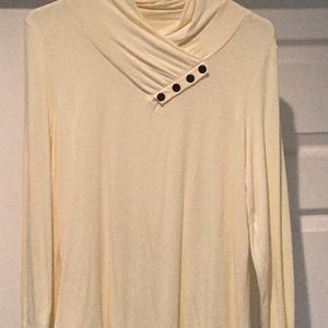 Top is pale and soft, with four buttons